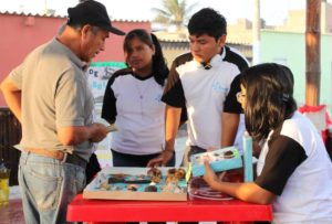 Puerto Chicama Fair_group around table_cropped